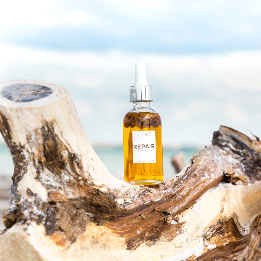 Bottle of Teami repair oil in nature