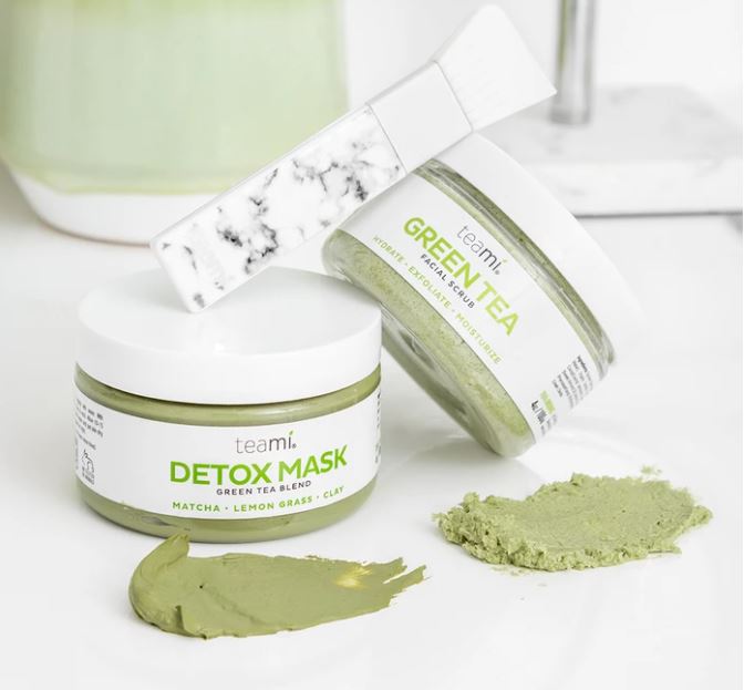 teami detox mask and green tea facial scrub on a counter