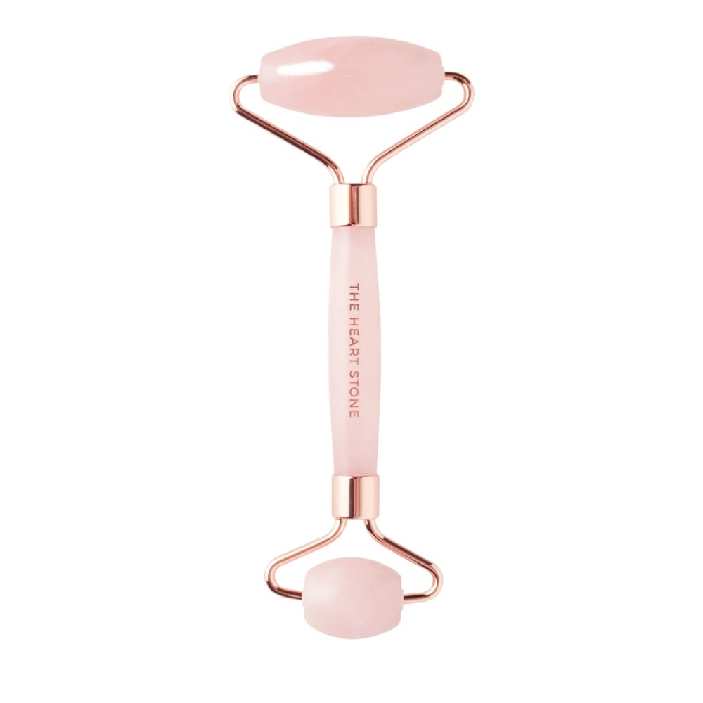 Teami Rose Quartz facial roller on white background