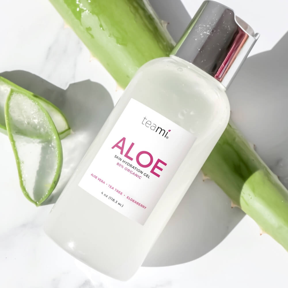 bottle of teami aloe organic skin hydration gel laying on greenery