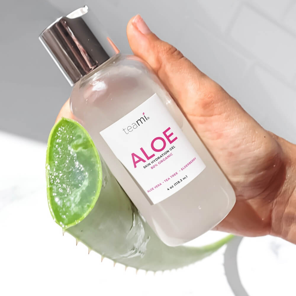somebody holding bottle of teami aloe organic skin hydration gel