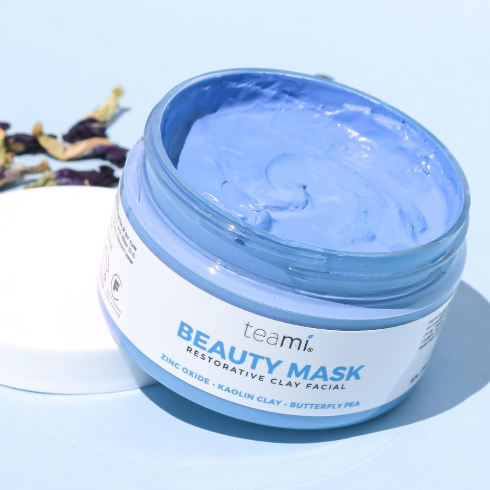 Tub of Teami beauty mask with zinc oxide, kaolin clay and butterfly pea balancing on lid