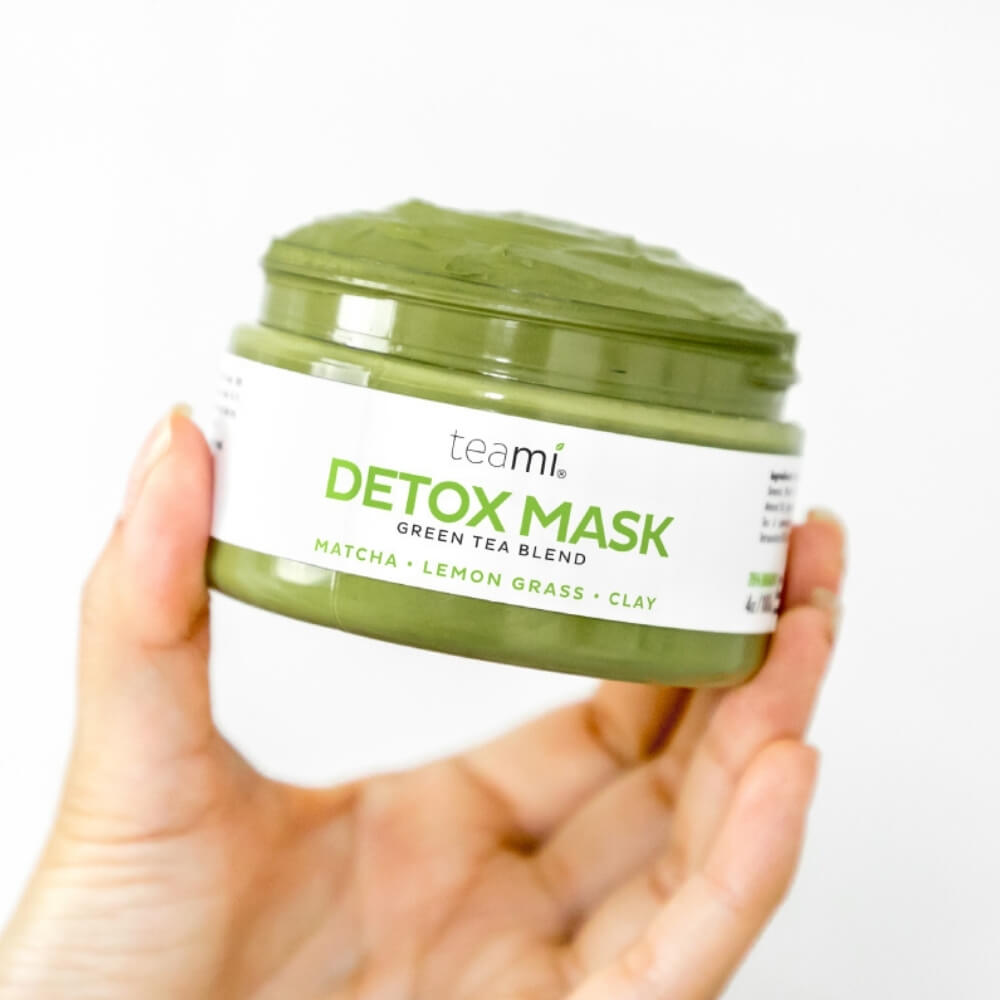 teami detox mask jar held in hand