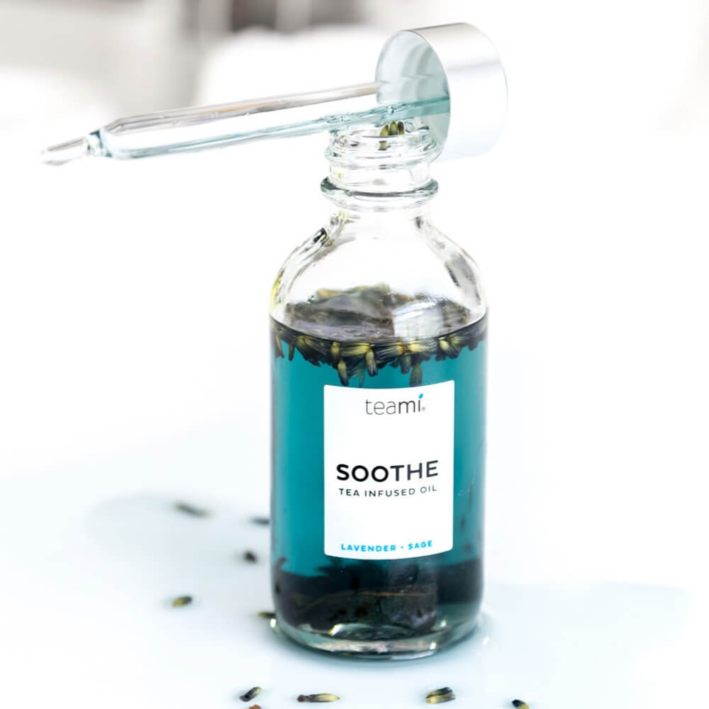 Teami soothe oil on white counter with lid off