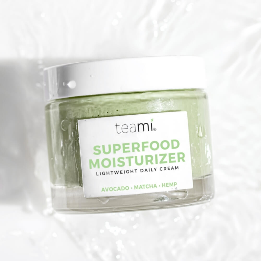Teami superfood moisturizer cream on white sink background