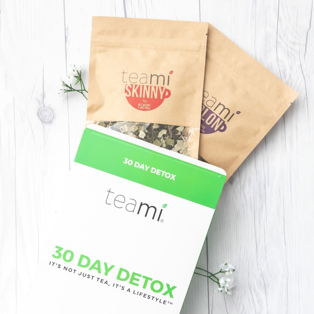 teami skinny, teami colon and 30 day detox package on a table