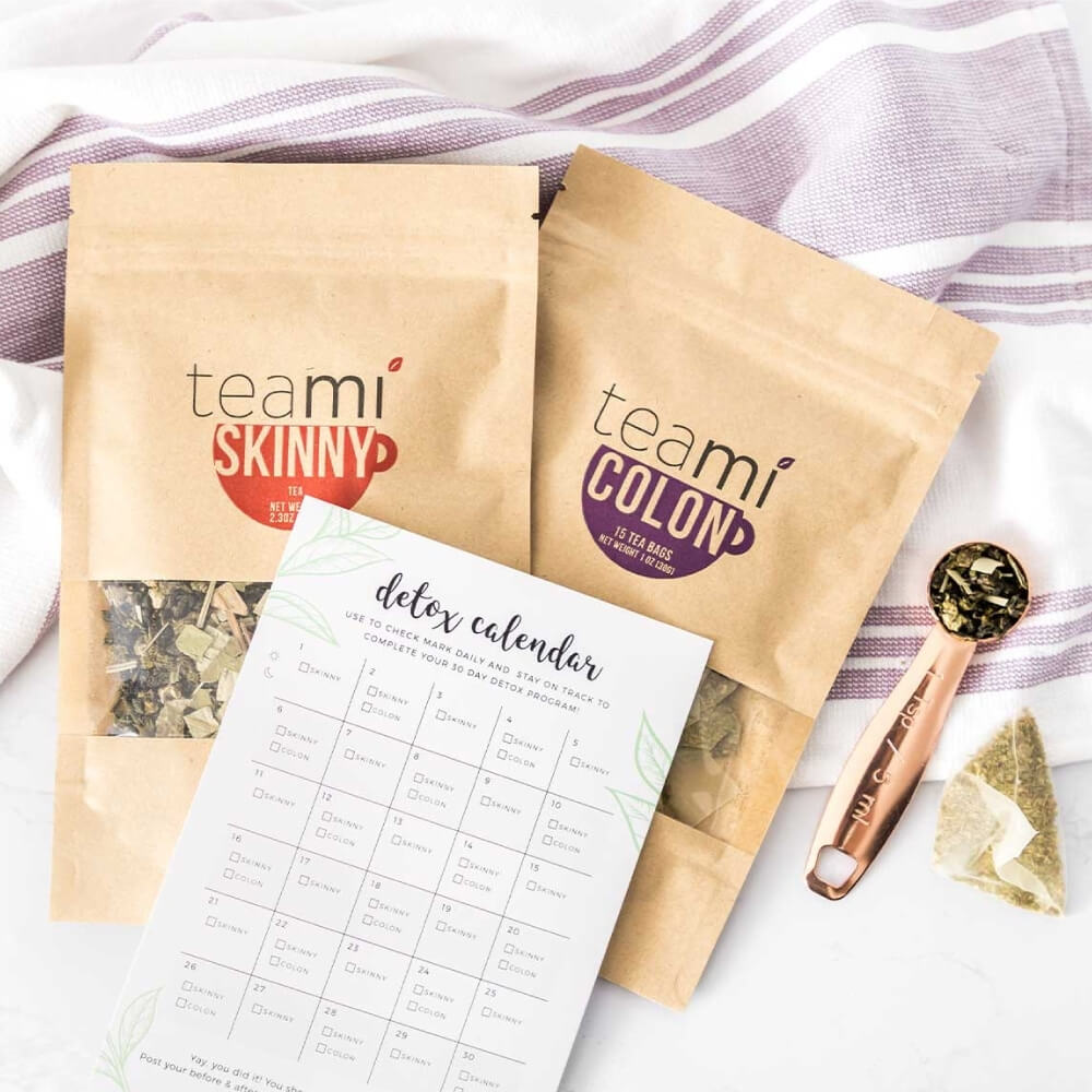 teami skinny tea, teami colon tea and teami detox calendar on a kitchen towel
