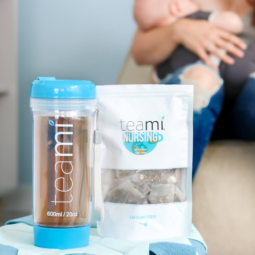Teami tea tumbler and pack of Teami nursing tea blend with mum and child in background