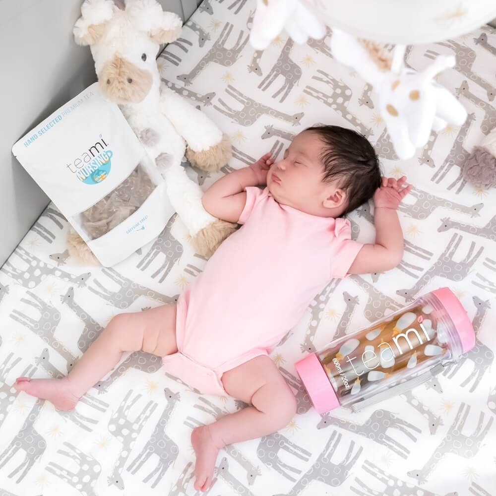 Child in crib with pack of Teami nursing tea blend