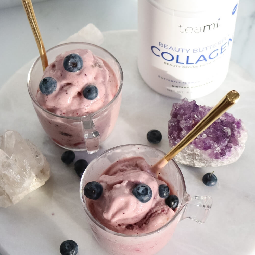 tub of Teami beauty butterfly collagen lying on marble surface