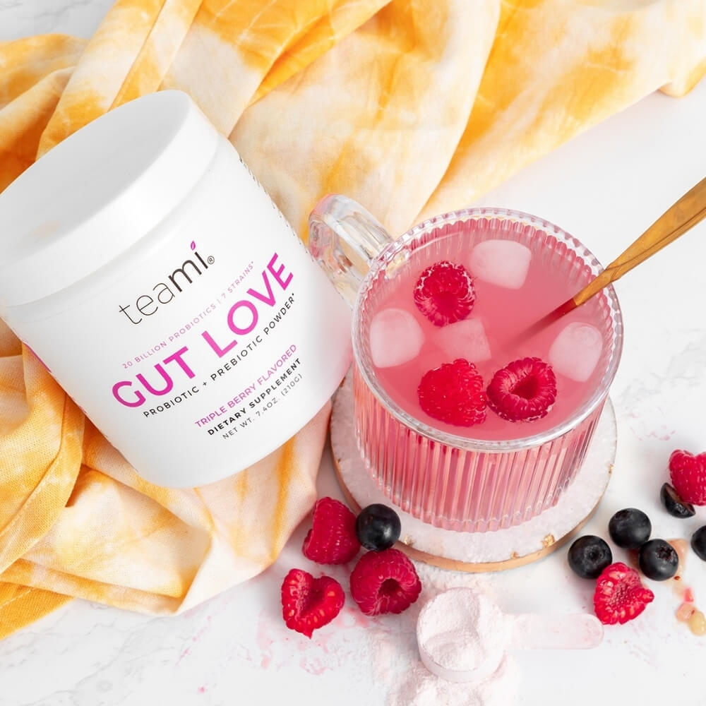 tub of Teami Gut Love triple berry flavour on white background